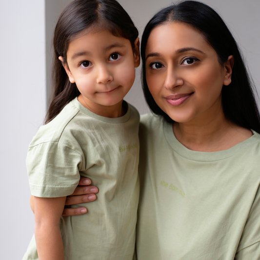 sage green kids t-shirt with the 5am club logo on the chest