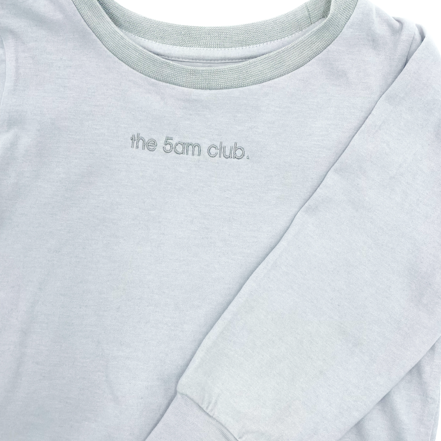 light grey long sleeve top from the 5am mama. The 5am club logo on the chest
