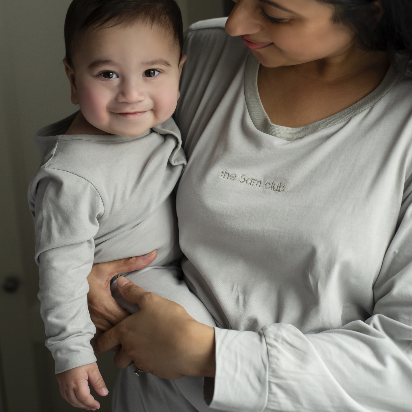 light grey long sleeve top from the 5am mama. The 5am club logo on the chest