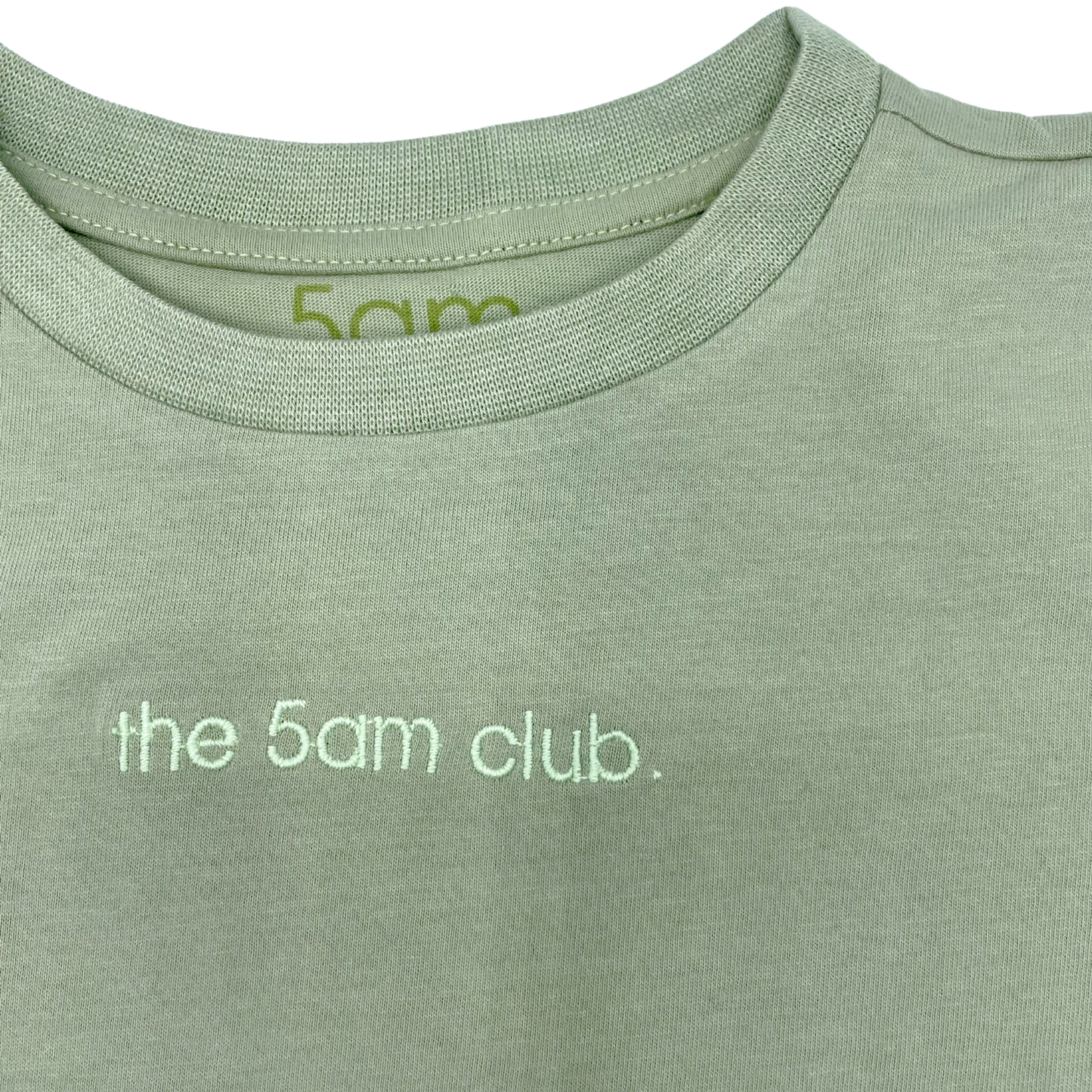 sage green kids t-shirt with the 5am club logo on the chest