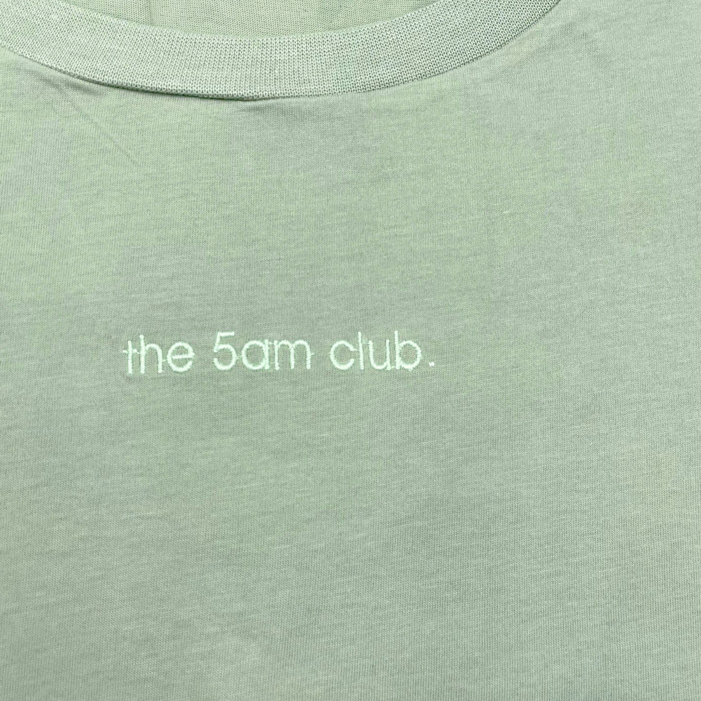 sage green womens t-shirt with the 5am club logo on the chest