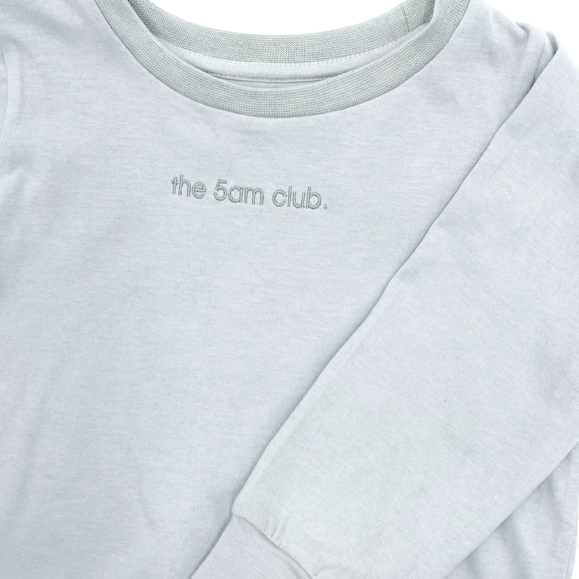 light grey long sleeve top from the 5am mama. The 5am club logo on the chest