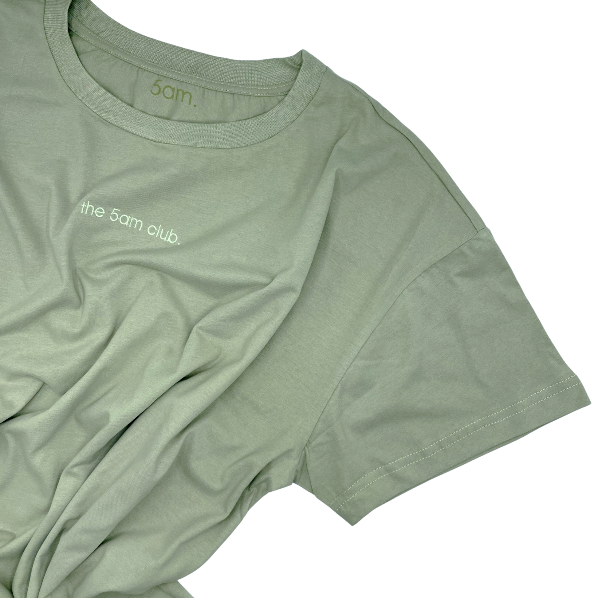 sage green womens t-shirt with the 5am club logo on the chest